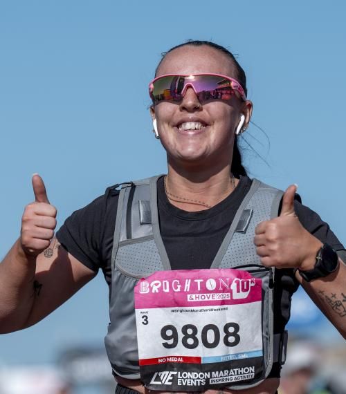 10K participant gives a thumbs up to the camera