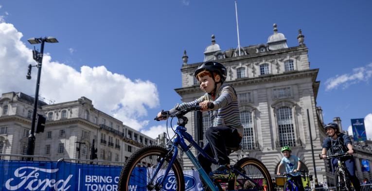 Young boy cycling at the free cycle event in central London.