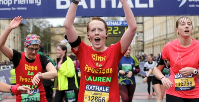 People finishing a half marathon