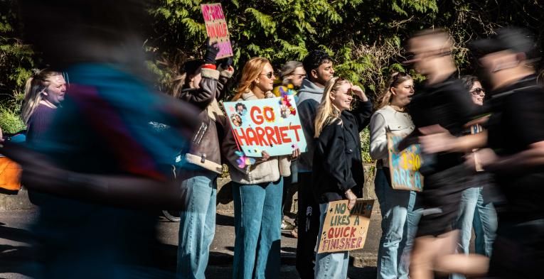 Supporters cheering on their runners