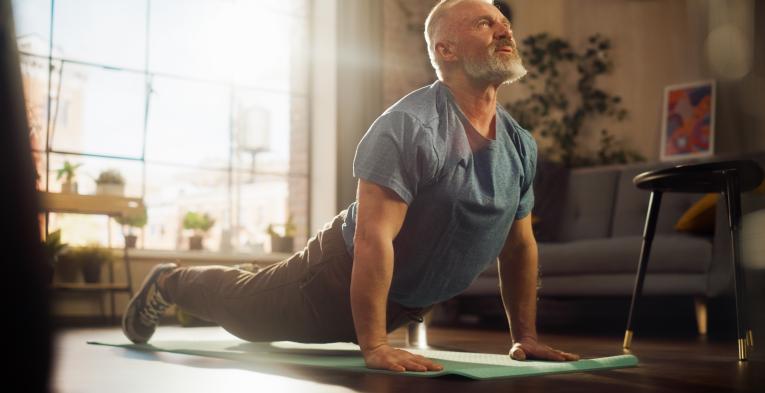 Man stretching in his front room