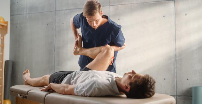 Man being treated by an osteopath