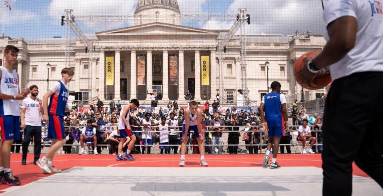 Basketball players on court at Trafalgar Square