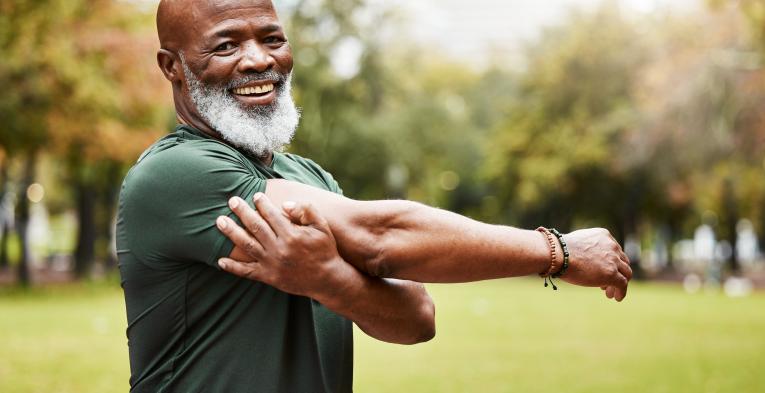 Runner stretching in the park