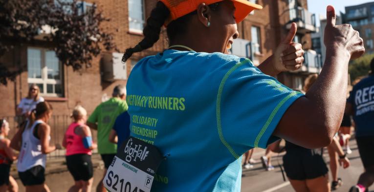 Sanctuary Runners participants gives a thumb up 