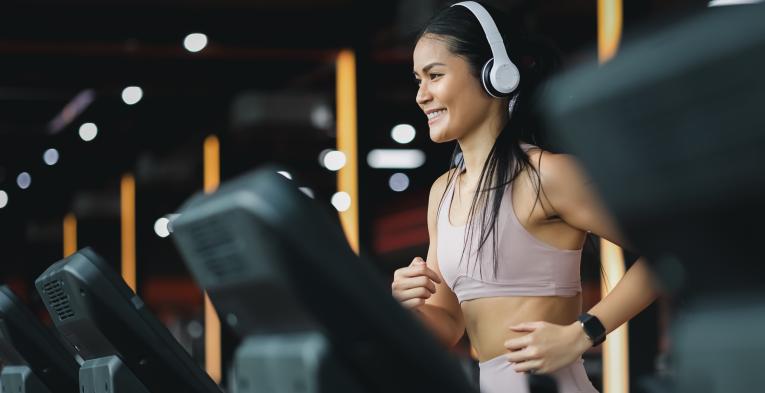 Person using a treadmill in a gym