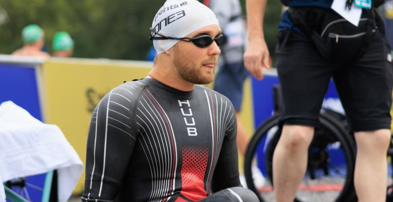Swimmer enters the water