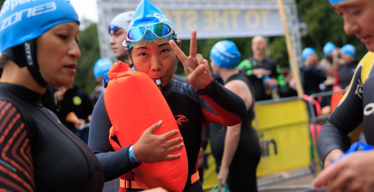 Swimmers blowing up their tow floats 