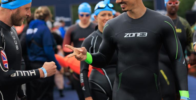 Swimmers play rock, paper, scissors at the Start 