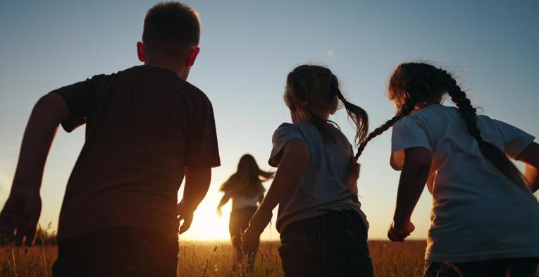Children running in a field