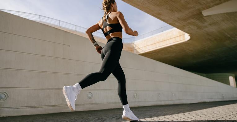 Woman running alone in a city 