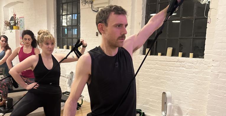 Freddie during a Reformer Pilates class 