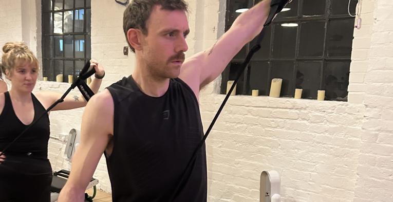 Freddie at a Reformer Pilates class
