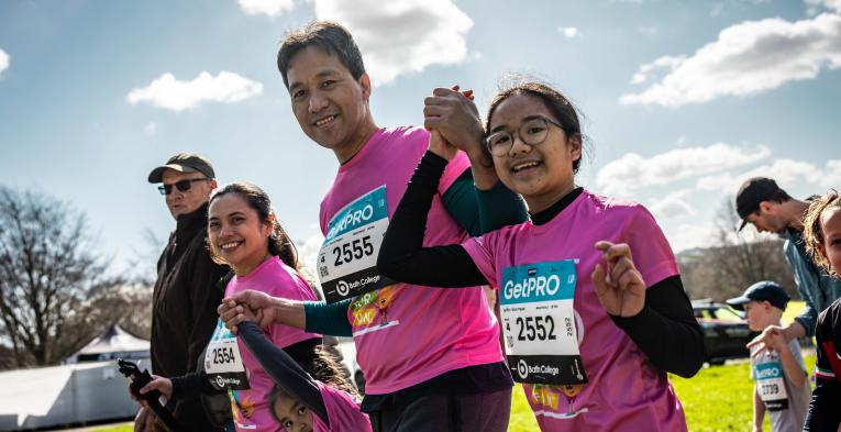 A family celebrates finishing the Bath Miles