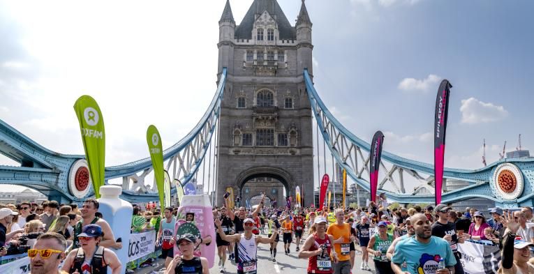 Participants running across Tower Bridge