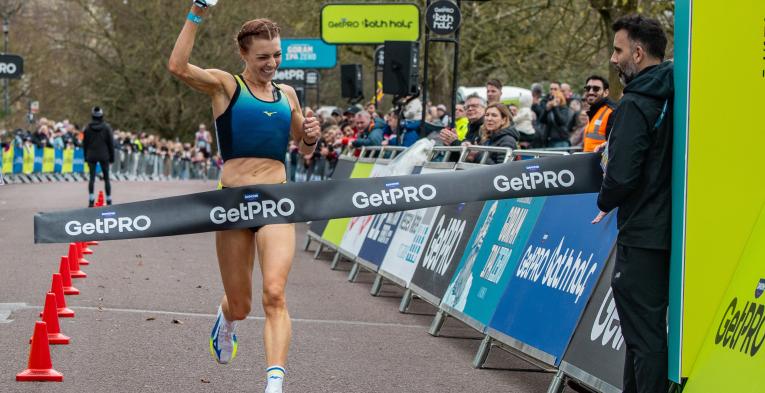 Alex Bell celebrates winning the 2026 GetPRO Bath Half
