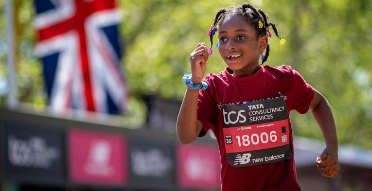A TCS Mini London Marathon participant approaches the Finish Line on The Mall