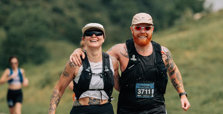 Runners arm in arm in Dorset