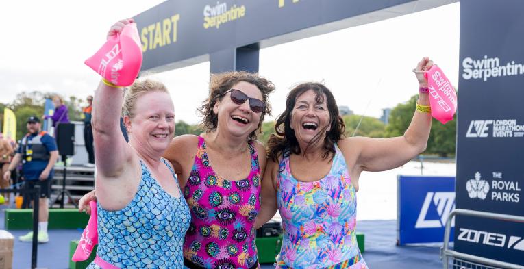 Finishers celebrate completing 2026 Swim Serpentine