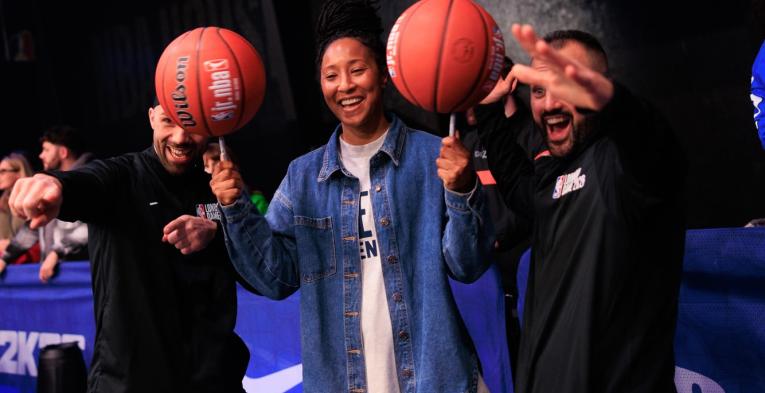 Player show how to spin basketballs on pens 