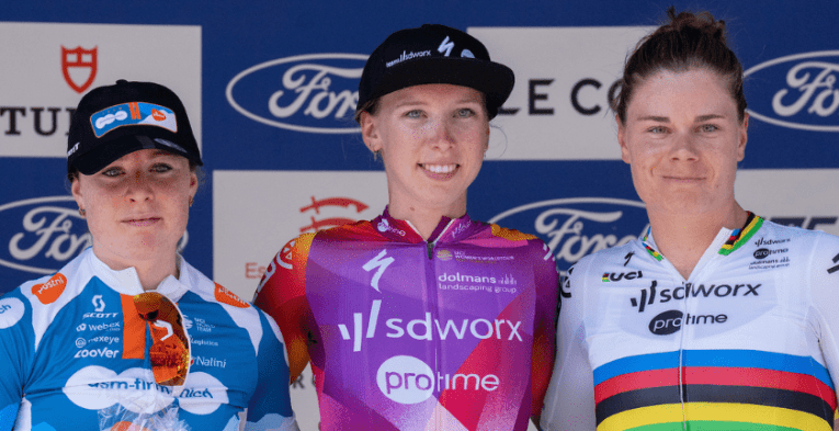 Lorena Wiebes (NED) of Team SD Worx Protime (NED), winner of Stage Two, celebrates on the podium alongside second place Charlotte Kool (NED) of Team dsm–firmenich PostNL (NED) and third placed Lotte Kopecky (BEL) of Team SD Worx Protime (NED) following Stage Two of the Ford RideLondon Classique on Saturday 25th May 2024