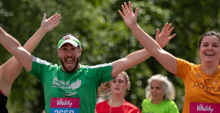 Runners approach the finish line at Buckingham Palace. The Vitality London 10,000, Monday 27
