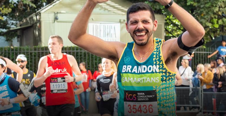 Samaritans charity runner celebrating at the TCS London Marathon