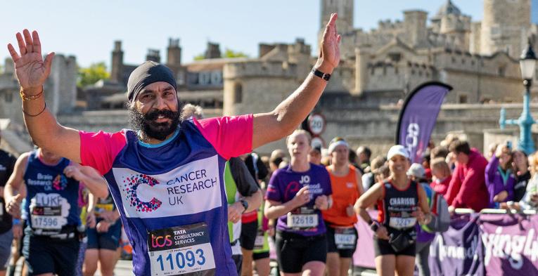 TCSLM 2022 charity runner with Tower of London in the background