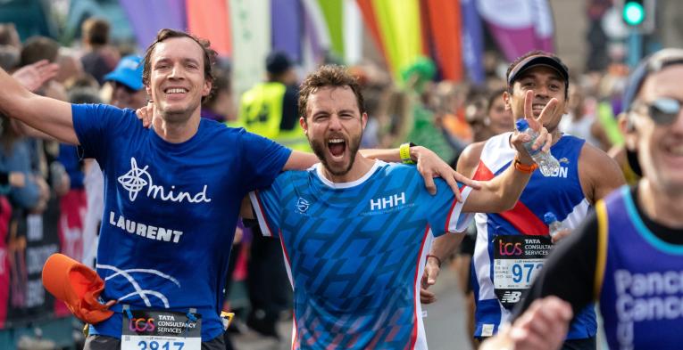 Runners cross Tower Bridge at the TCS London Marathon