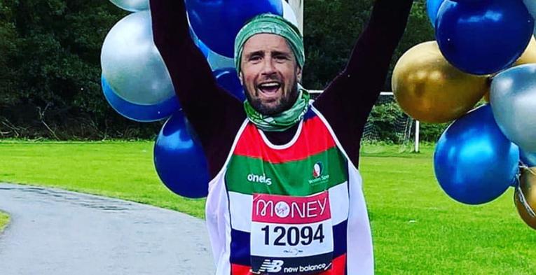 A virtual TCS London Marathon runner celebrates after completing his run