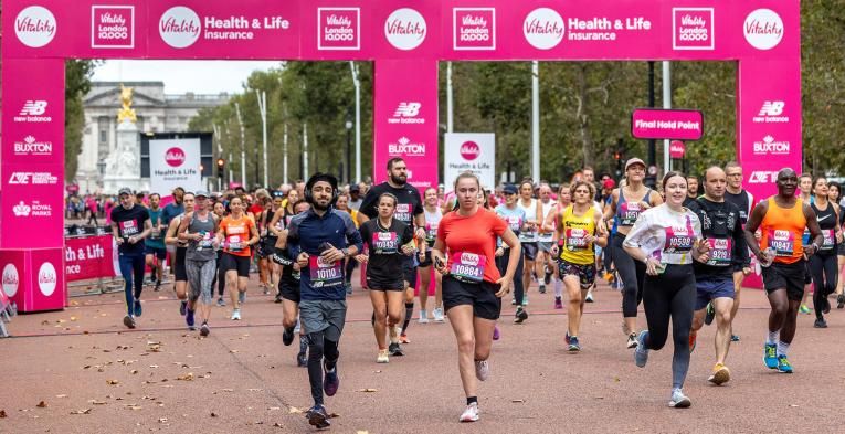 A mass of runners leave the Vitality London 10000 Start Line