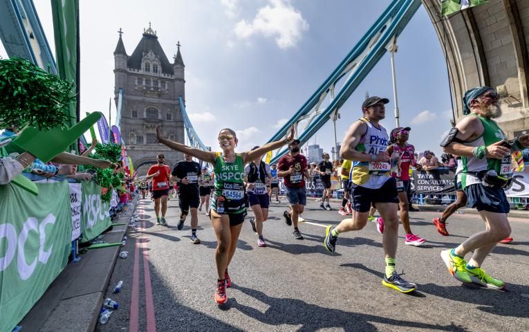 Participants running across Tower Bridge