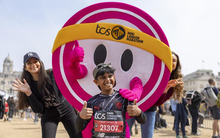 Participants pose with The Dot mascot