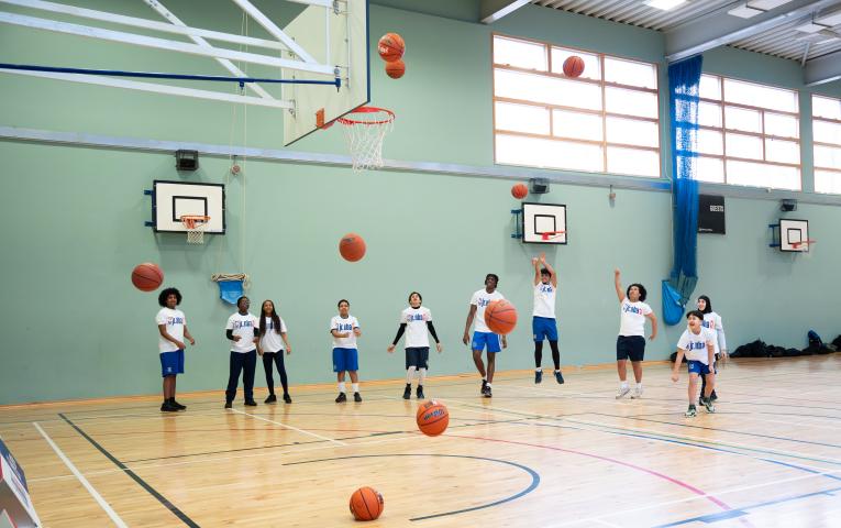 Young people shooting hoops for the Jr. NBA 3v3 launch 
