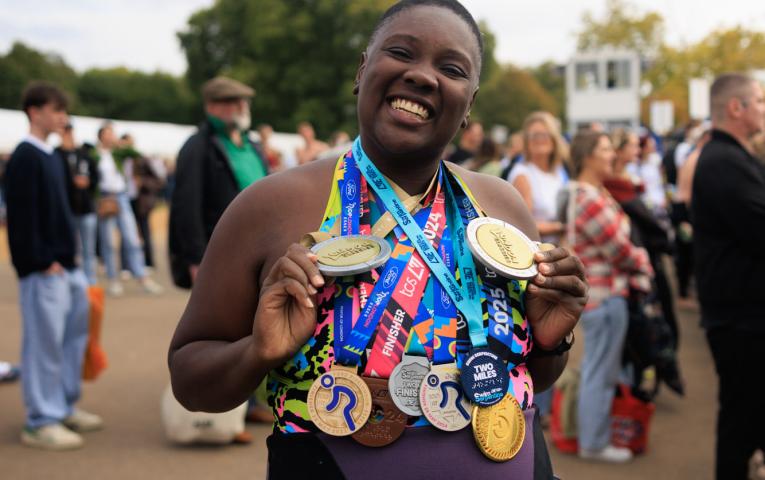 Swimmer with two sets of London Classics medals
