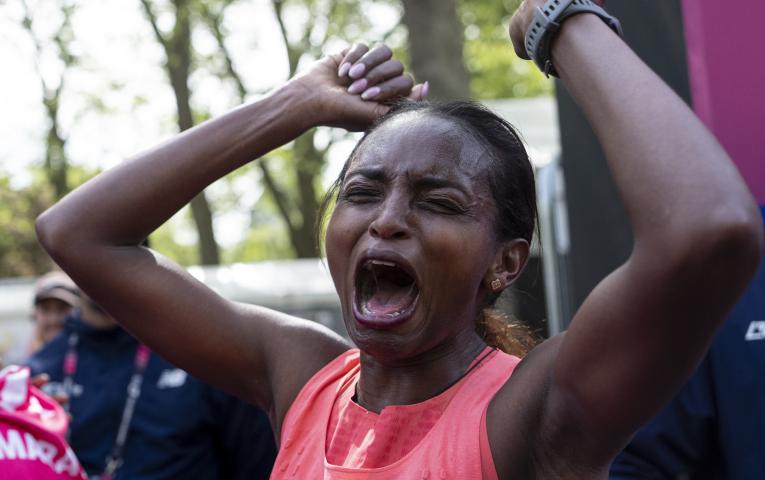 Tigst Assefa screams with joy at the Finish Line