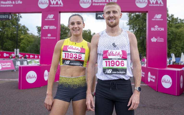 Holly Dixon (L) and Joe Wigfield (R) pose for a picture following crossing the line in first