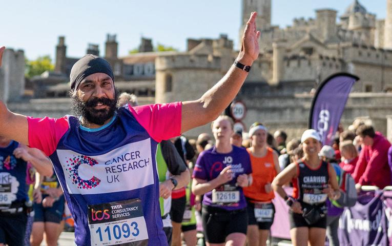 TCSLM 2022 charity runner with Tower of London in the background
