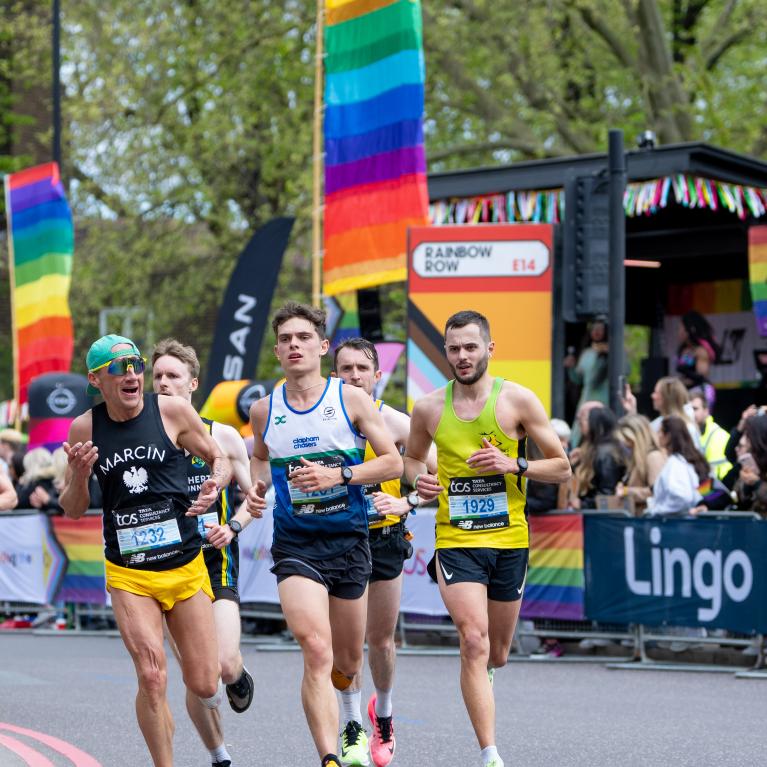 Runners pass through Rainbow Row 