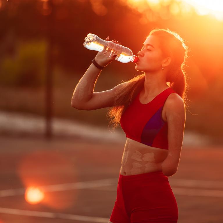 Portrait young woman athlete with an amputated arm 