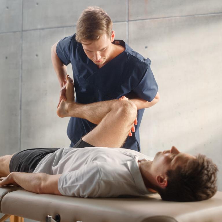 Man being treated by an osteopath