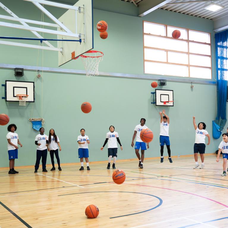 Young people shooting hoops for the Jr. NBA 3v3 launch 