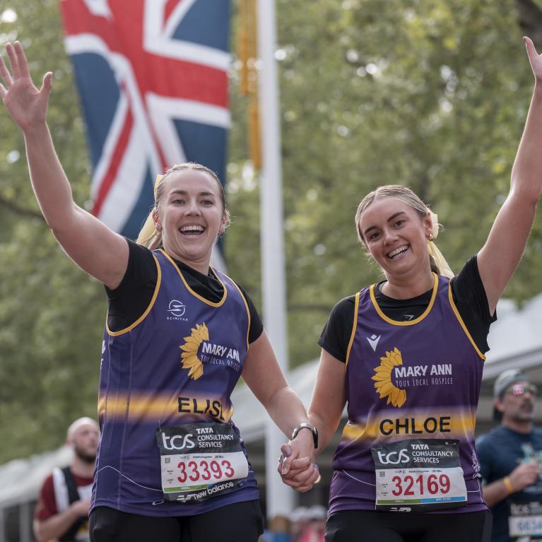 Charity runners about to cross the Finish Line
