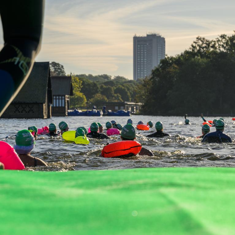 Swim participants entering the water