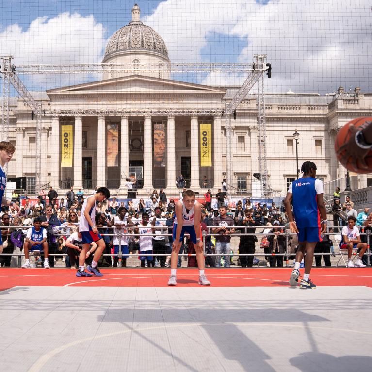 Basketball players on court at Trafalgar Square