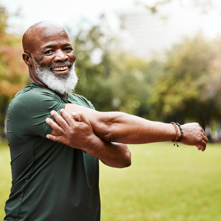 Runner stretching in the park