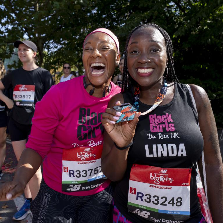 New Balance Big Half relay participants show off their medals