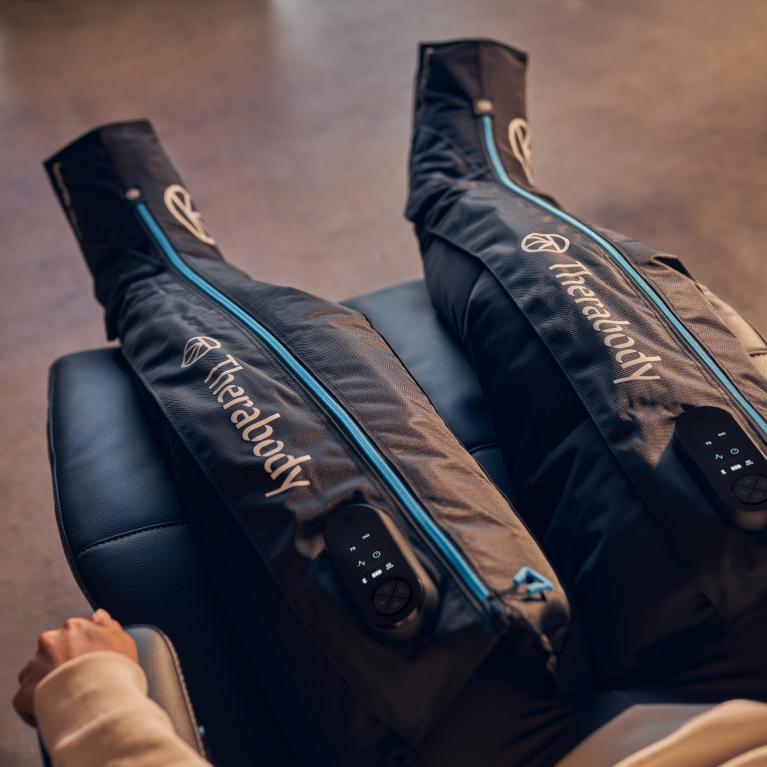 A runner using the Therabody JetBoots 