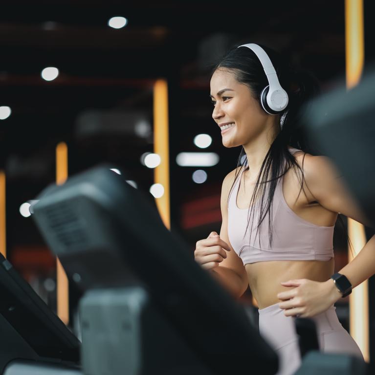 Person using a treadmill in a gym