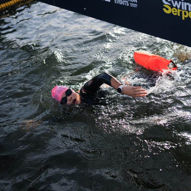 Swimmer passes under the Finish 